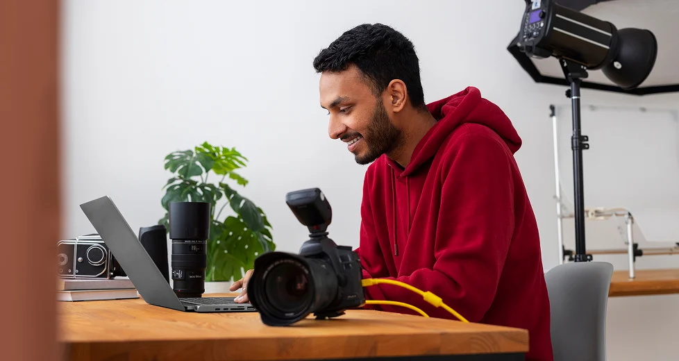 medium shot specialized photographer working studio 1